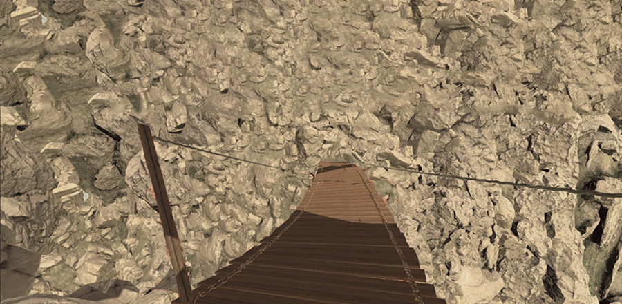 VR Stress Tester, flimsy looking wooden-slat bridge to large rock wall