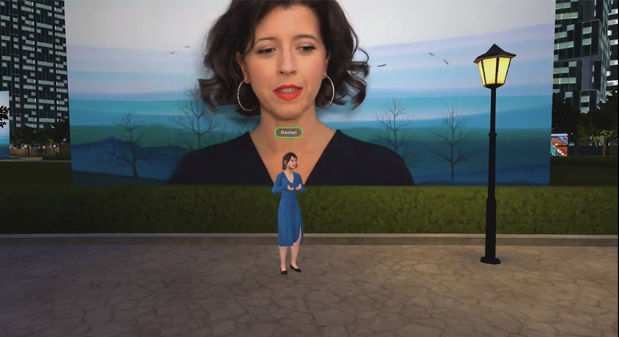 This is a screen capture of a student doing a presentation on branding of a well-known opera star. She is standing in front of a large video screen while a video of the artists is playing. The ability to see videos in such a large scale has a wonderful impact. She was also able to have photos of this artist to the sides of where the class was standing so that she could easily direct them to turn and see anything whe wished to reference during her presentation.  